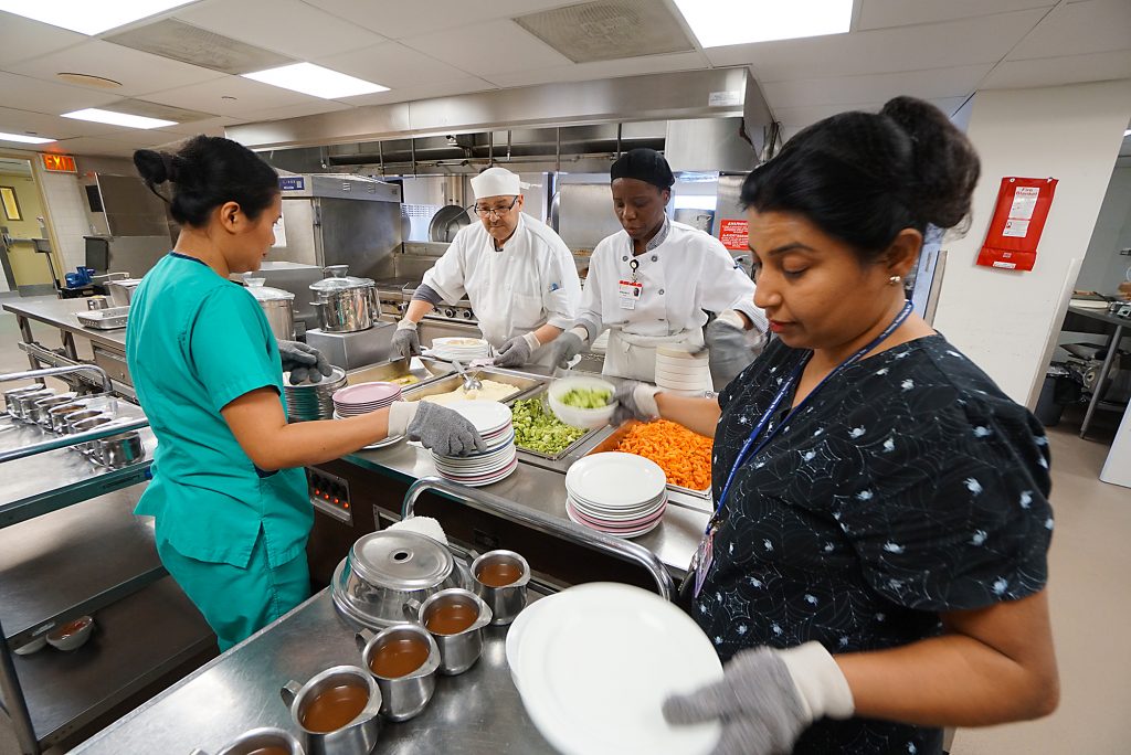 A photo of dietary staff preparing a nutritious meal.