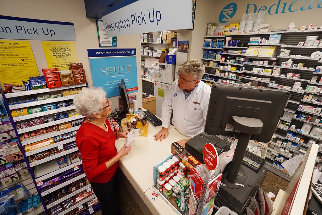 A photo of a tenant shopping at the Shoppers Drug Mart inside of Holland Christian Homes.