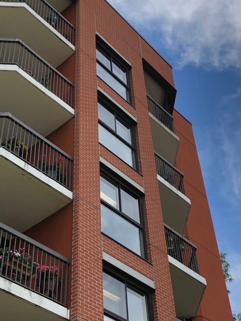 A outdoor photo of Covenant Tower's balconies. 
