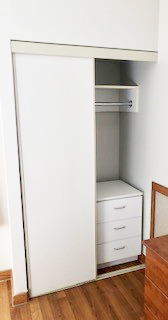 A basic room's closet in a Grace Manor floor.