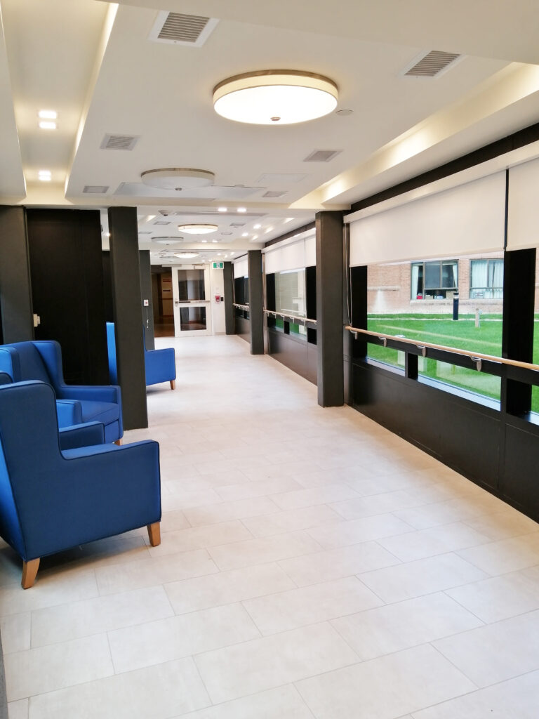 A corridor leading to a Faith Manor floor.